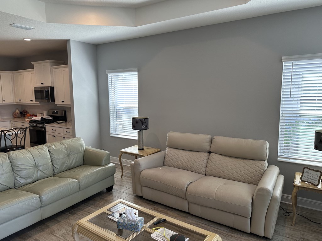 a living room with two couches and a coffee table