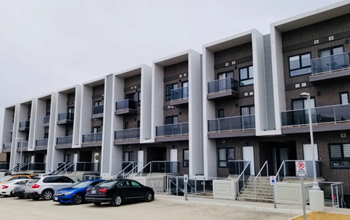 a building with cars parked in front of it