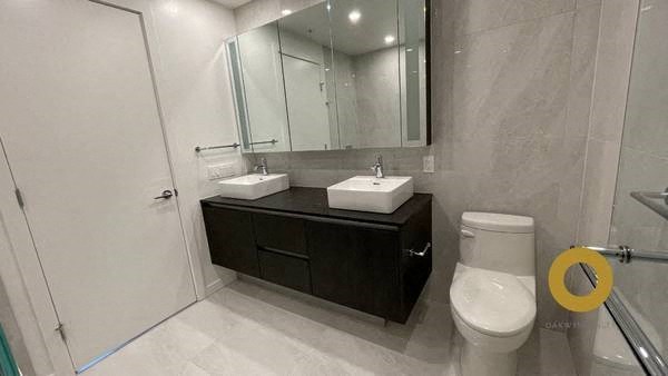 a bathroom with a toilet sink and a mirror