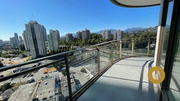 a view of the city from a balcony on a train