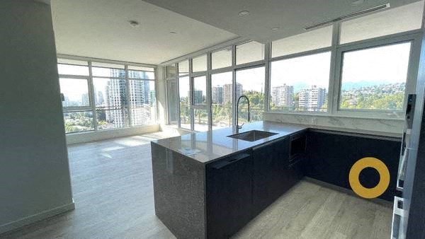 a kitchen with a large amount of windows and a sink