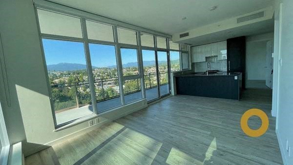 an empty living room with a view of the city