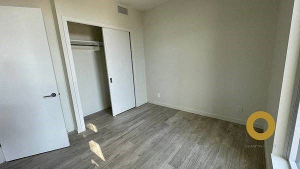 a empty room with a door to a closet