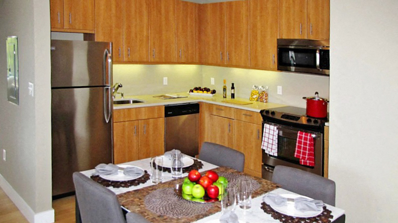 a kitchen and dining room with a table and chairs