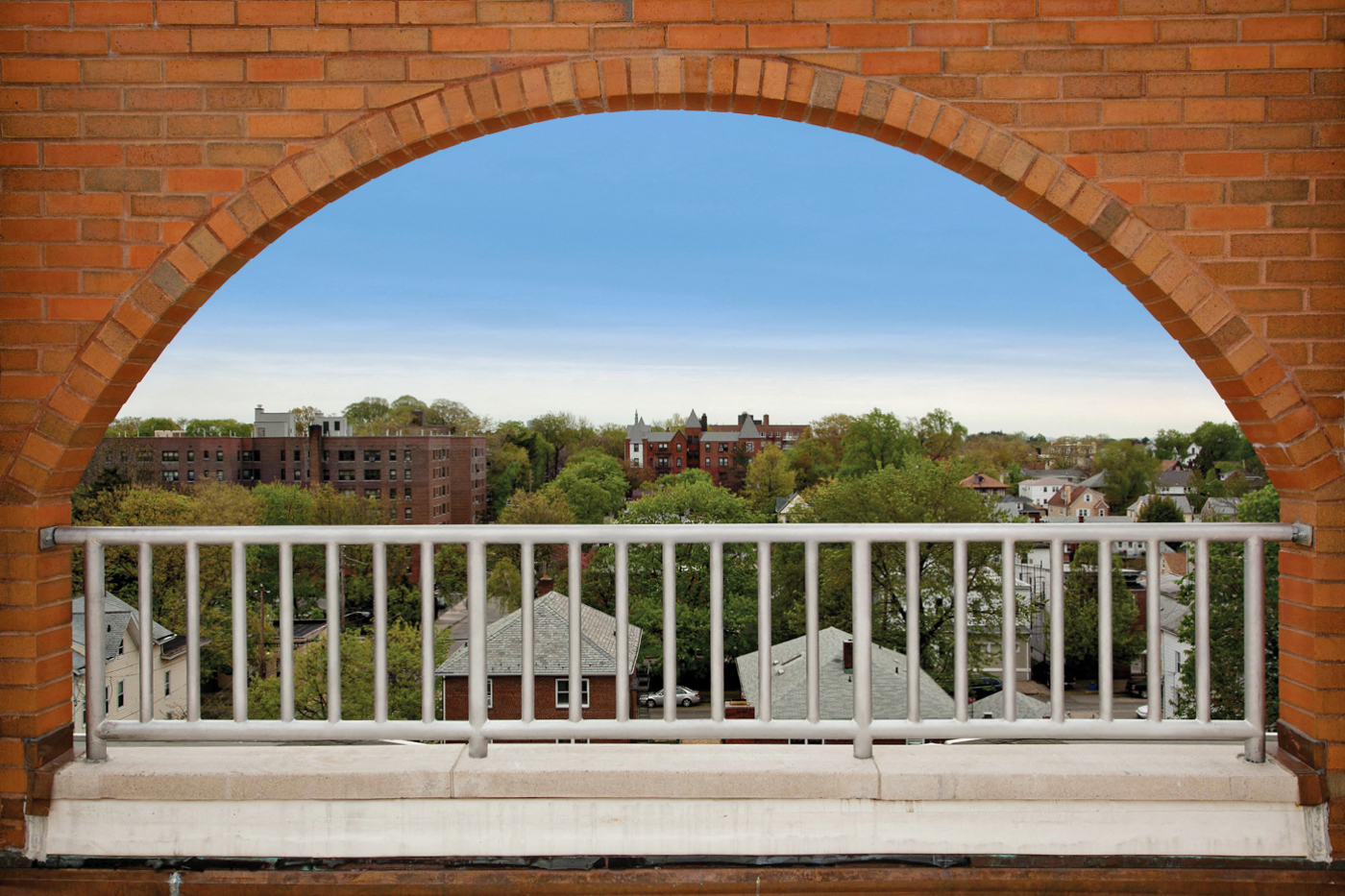 a view of the city from the balcony of a building