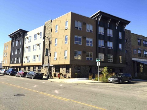 a new apartment building on the corner of a street