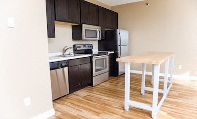 a small kitchen with a wooden table