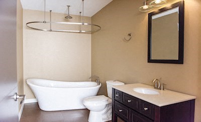 a bathroom with a sink toilet and a bath tub