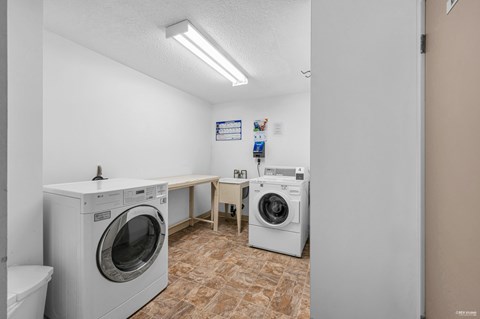 A laundry room with a washer and dryer.