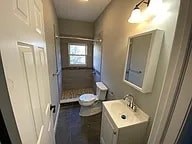 A small bathroom with a toilet and sink.