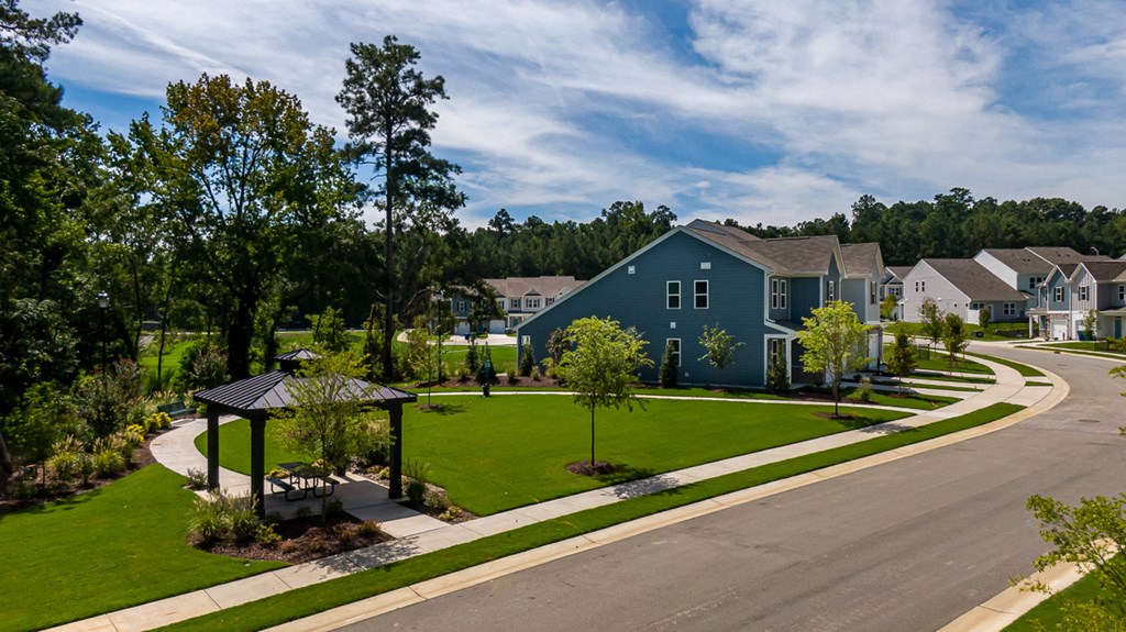 a row of houses on the side of a street