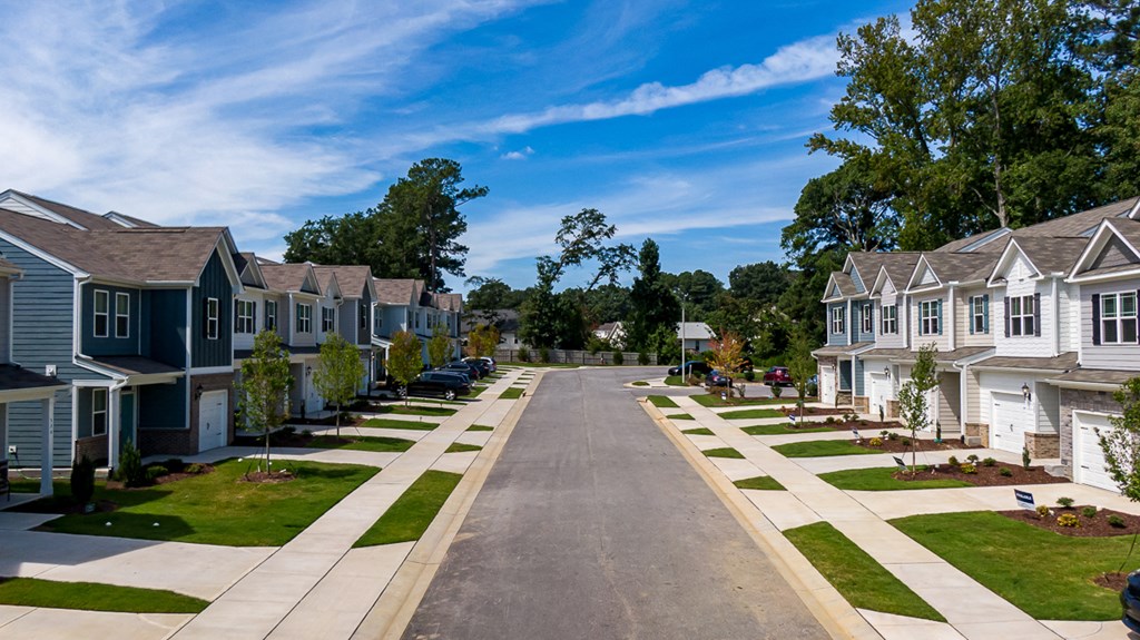 a row of houses on the side of a street