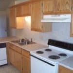 a kitchen with a stove and a sink