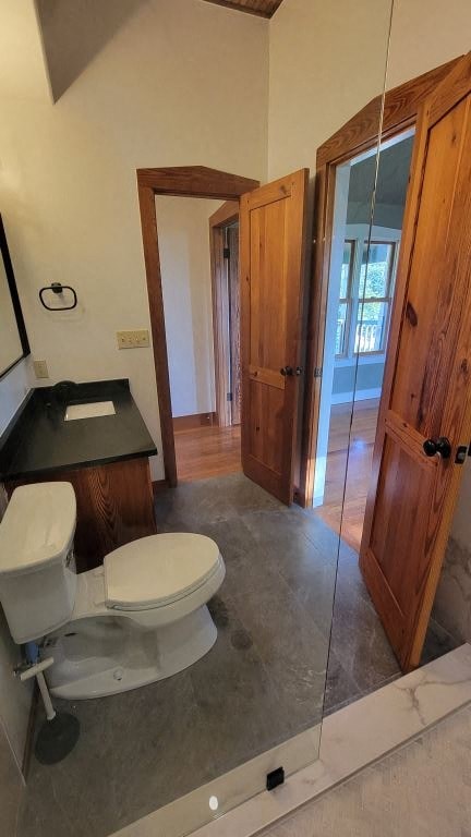 a bathroom with a toilet and a mirror