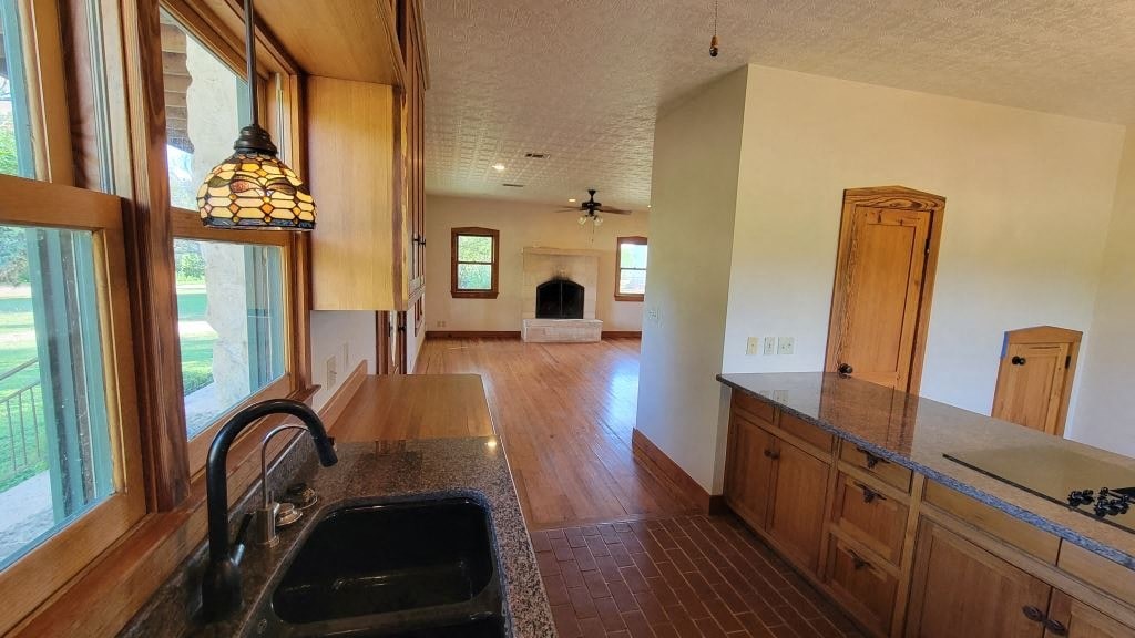 a kitchen with a sink and a view of a living room