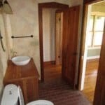 a bathroom with a toilet and a sink in it