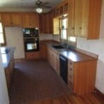 a kitchen with wooden cabinets and a counter top