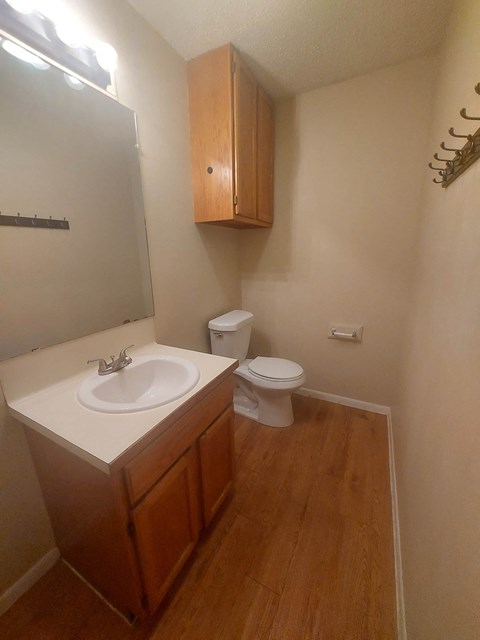 A small bathroom with a toilet and sink.