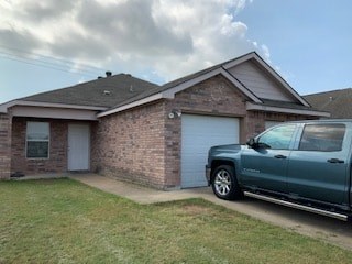 A house with a grey truck parked in front.