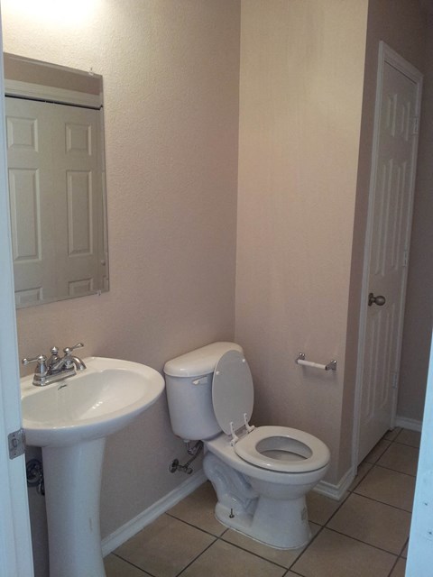 a bathroom with a toilet and a sink
