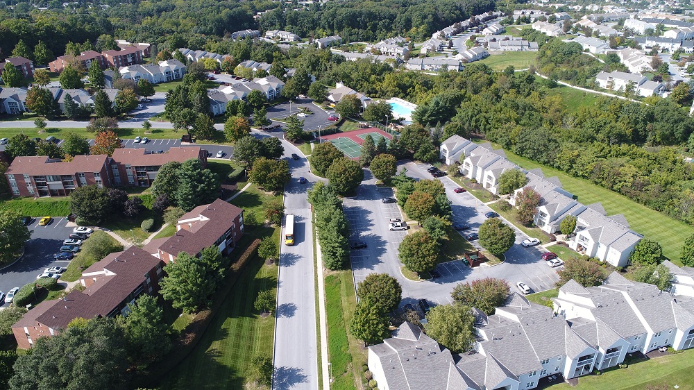 an aerial view of a neighborhood with houses and trees