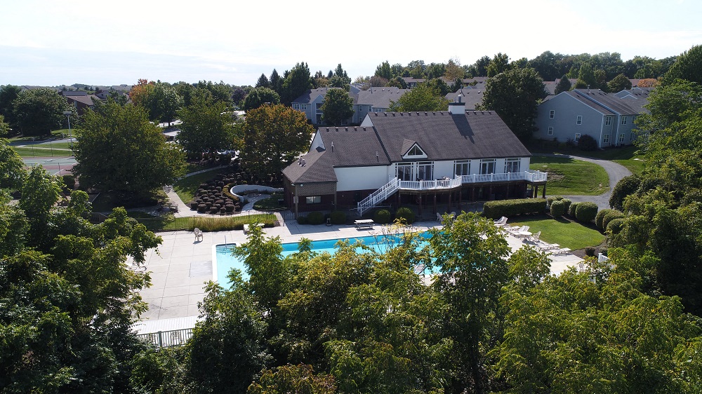 an aerial view of a house with a swimming pool