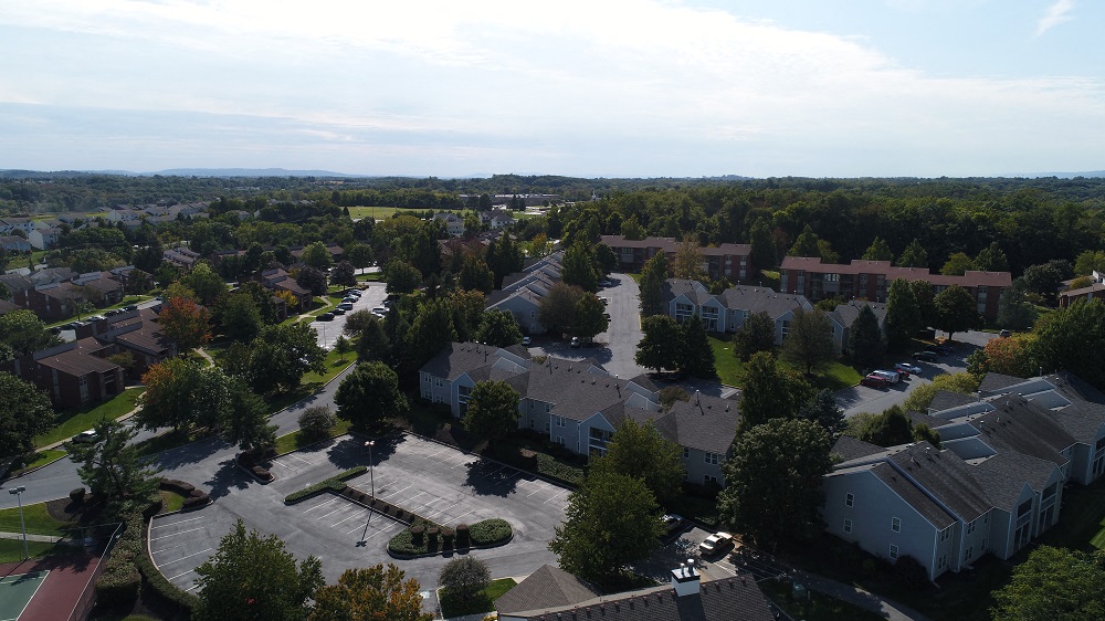 an aerial view of a neighborhood with houses and trees