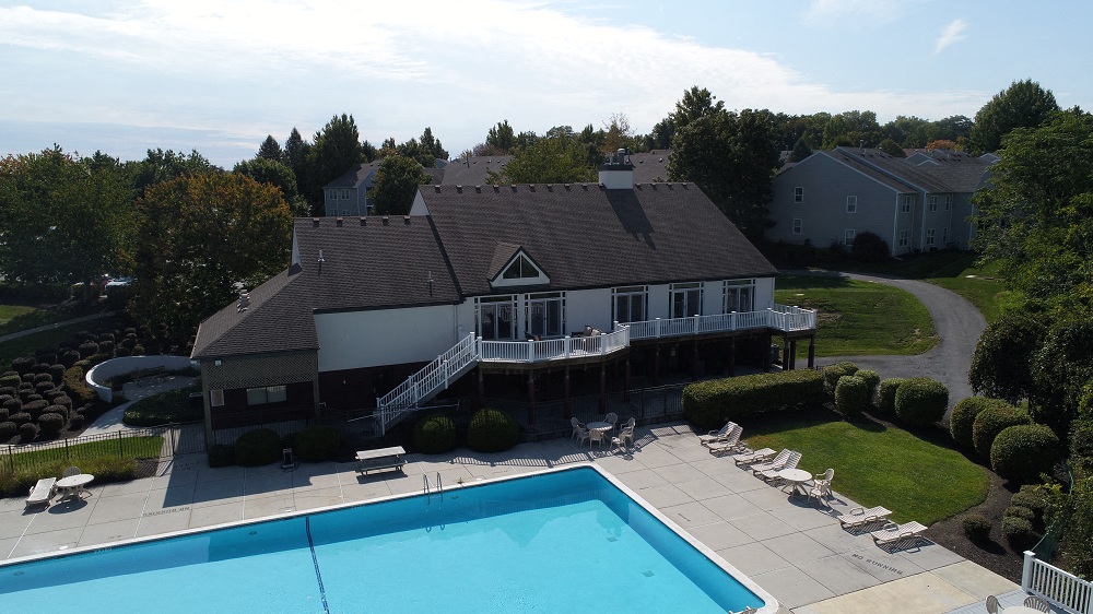 a aerial view of a house with a swimming pool
