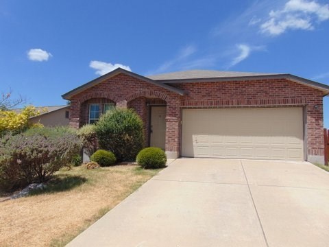 a house with a driveway and a garage door