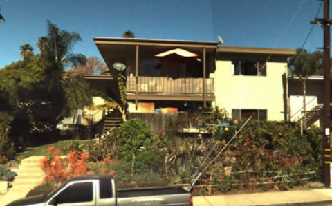 a house with a truck parked in front of it