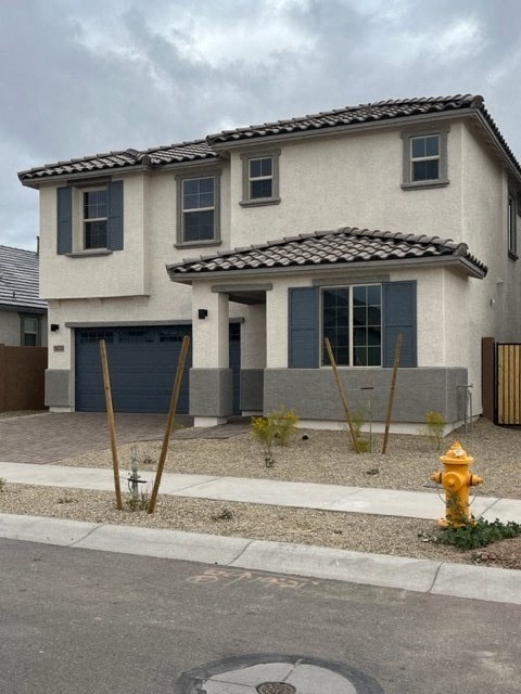 a house with a yellow fire hydrant in front of it