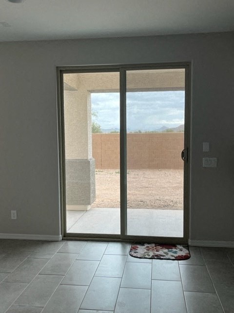 an empty living room with a sliding glass door