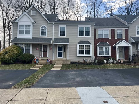 a house with a large driveway in front of it