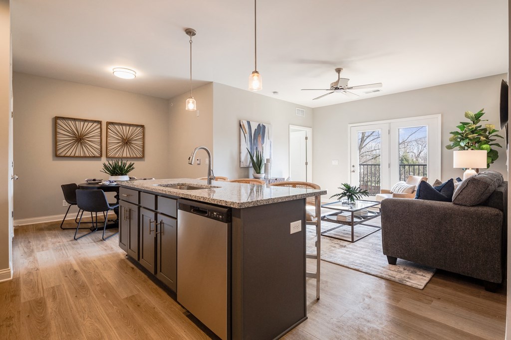 an open floor plan with an island kitchen and living room