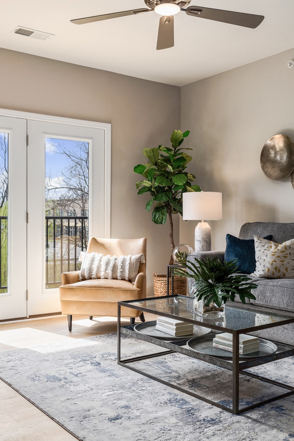 a living room with a couch and a glass coffee table