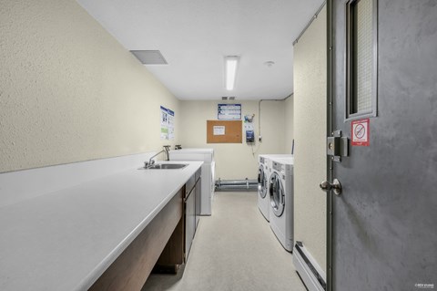 A laundry room with a washer and dryer.