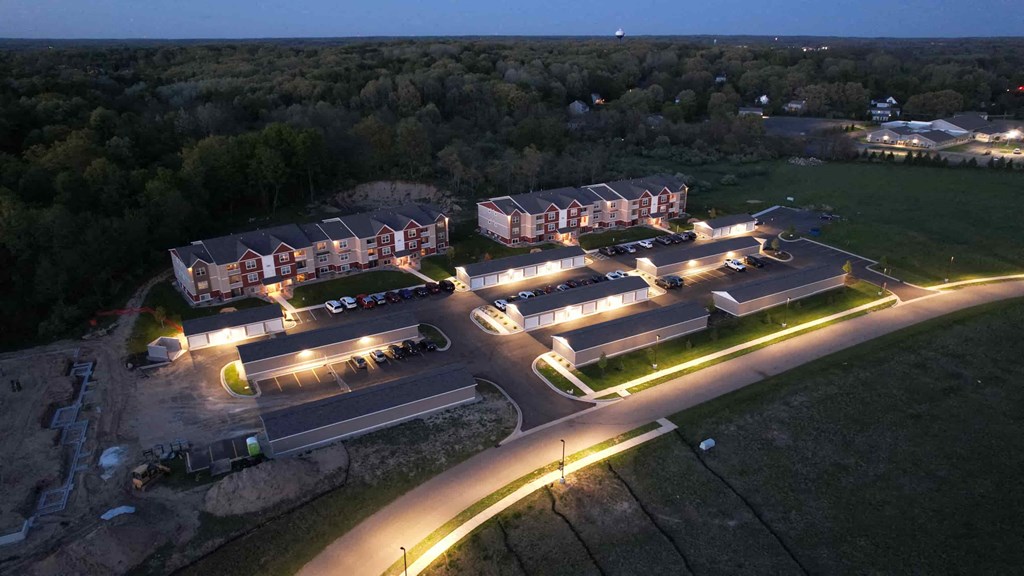 an aerial view of a building complex at night