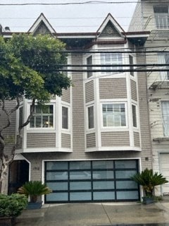 the front of a house with a garage