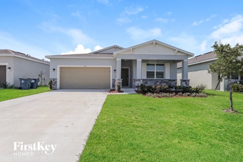 a house with a driveway and a garage door