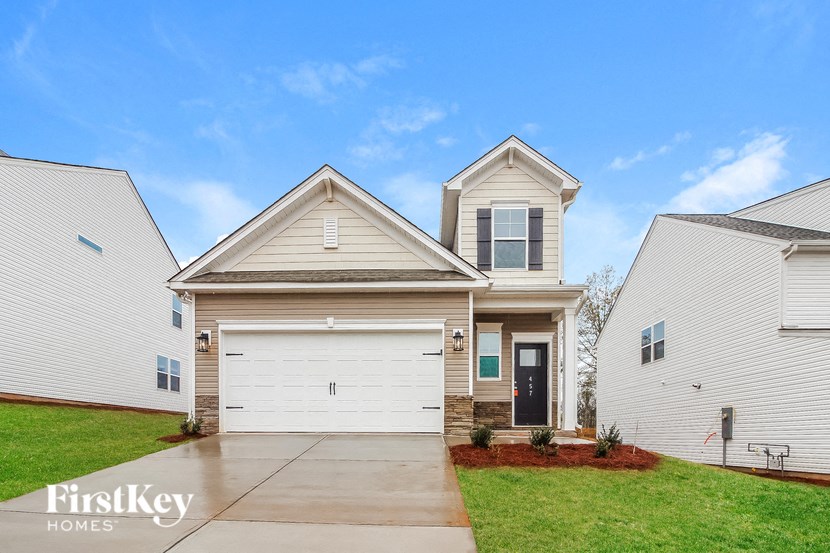 a white house with a white garage door