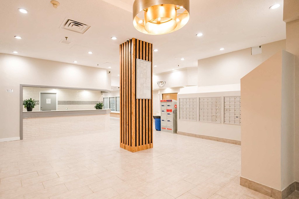 a large lobby with a column in the middle of it