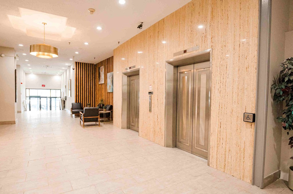 the lobby of the building is clean and empty