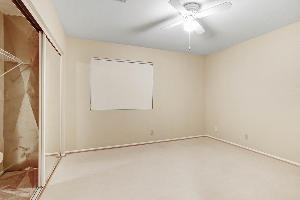 Empty room with a whiteboard on the wall.