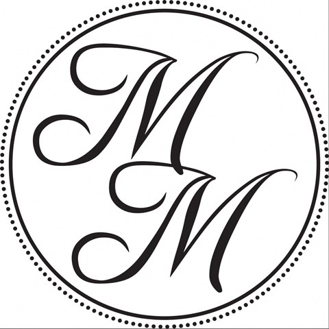 A black and white image of the letter M in a circle.