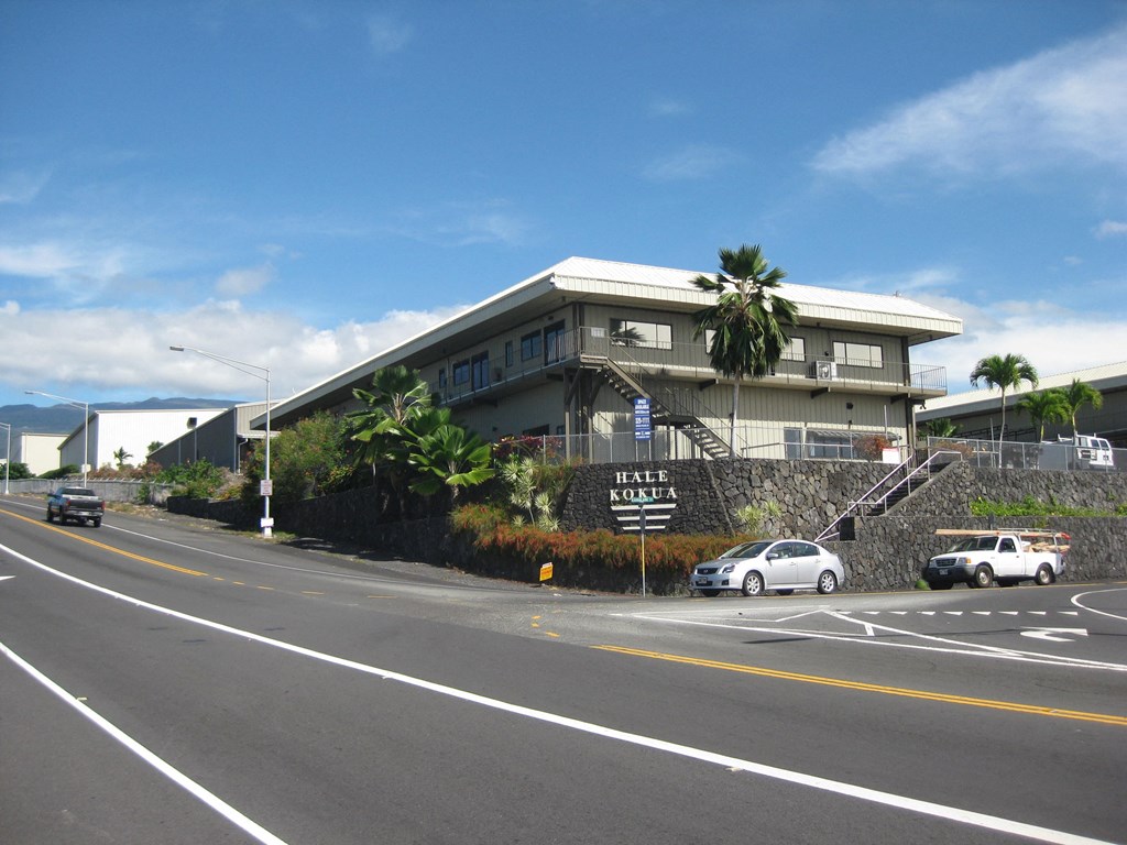 an old building on the side of a road