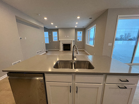 a kitchen with a sink and a counter top