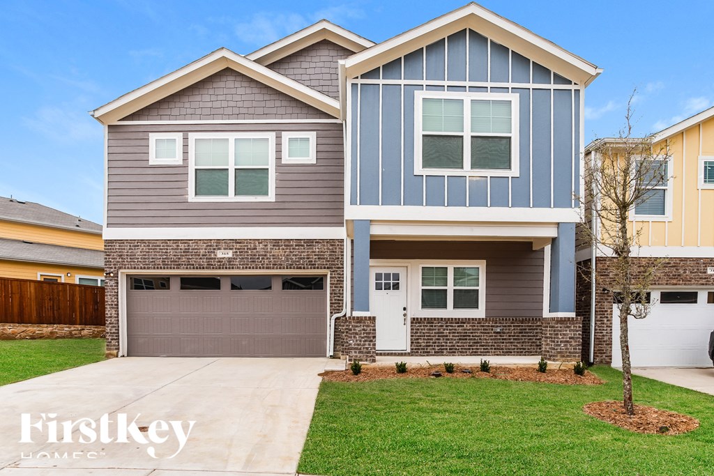 a brand new house with a garage door