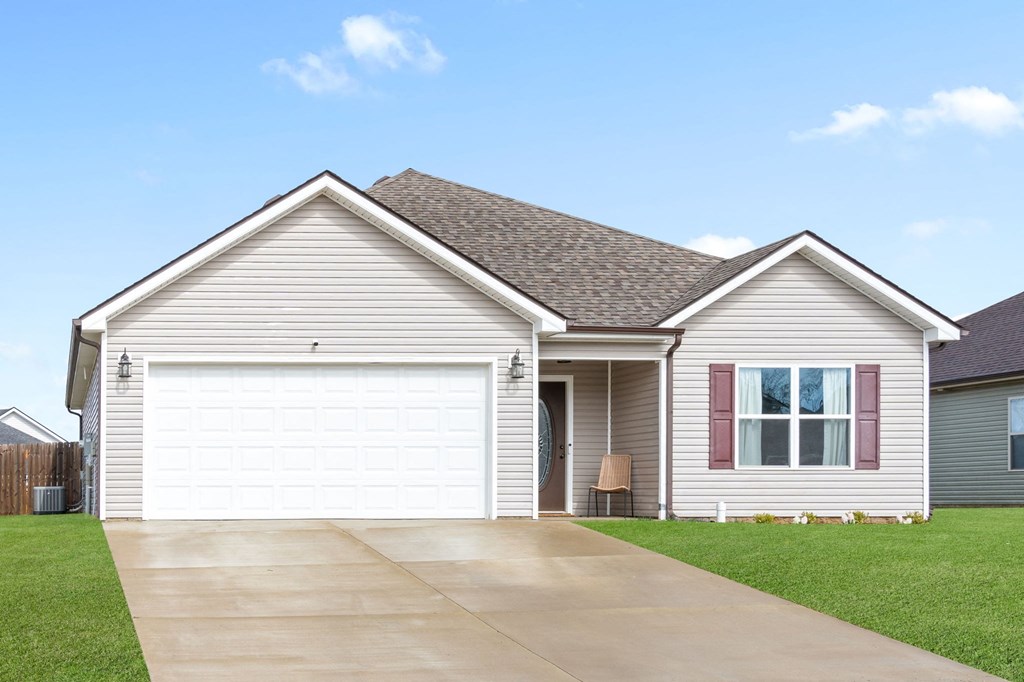 a house with a driveway and a garage door