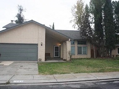 a house with a driveway and a garage door