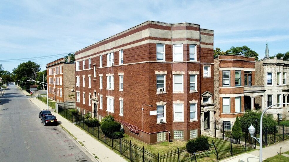 a red brick building on the side of a street